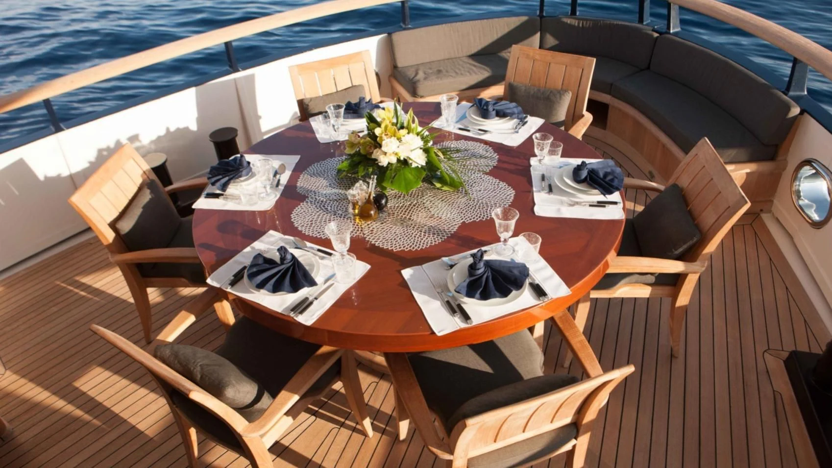 a table with plates and napkins on it aboard ICE LADY Yacht for Sale