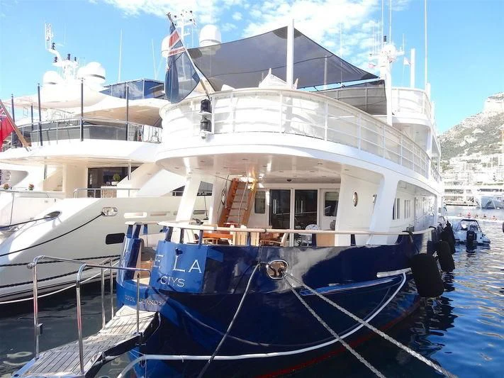 a large white boat with blue ropes aboard ICE LADY Yacht for Sale