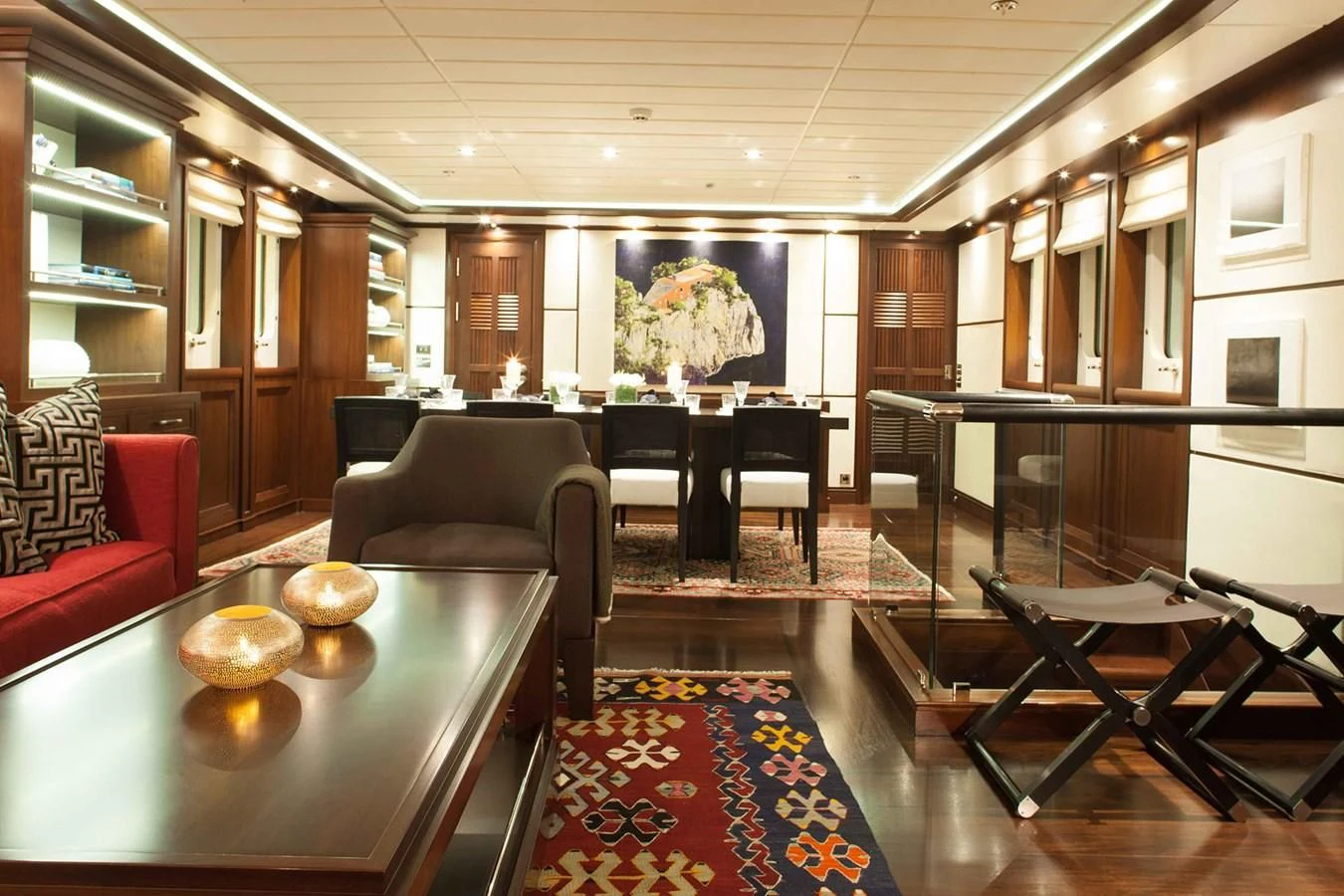 a room with a table chairs and a rug aboard ICE LADY Yacht for Sale