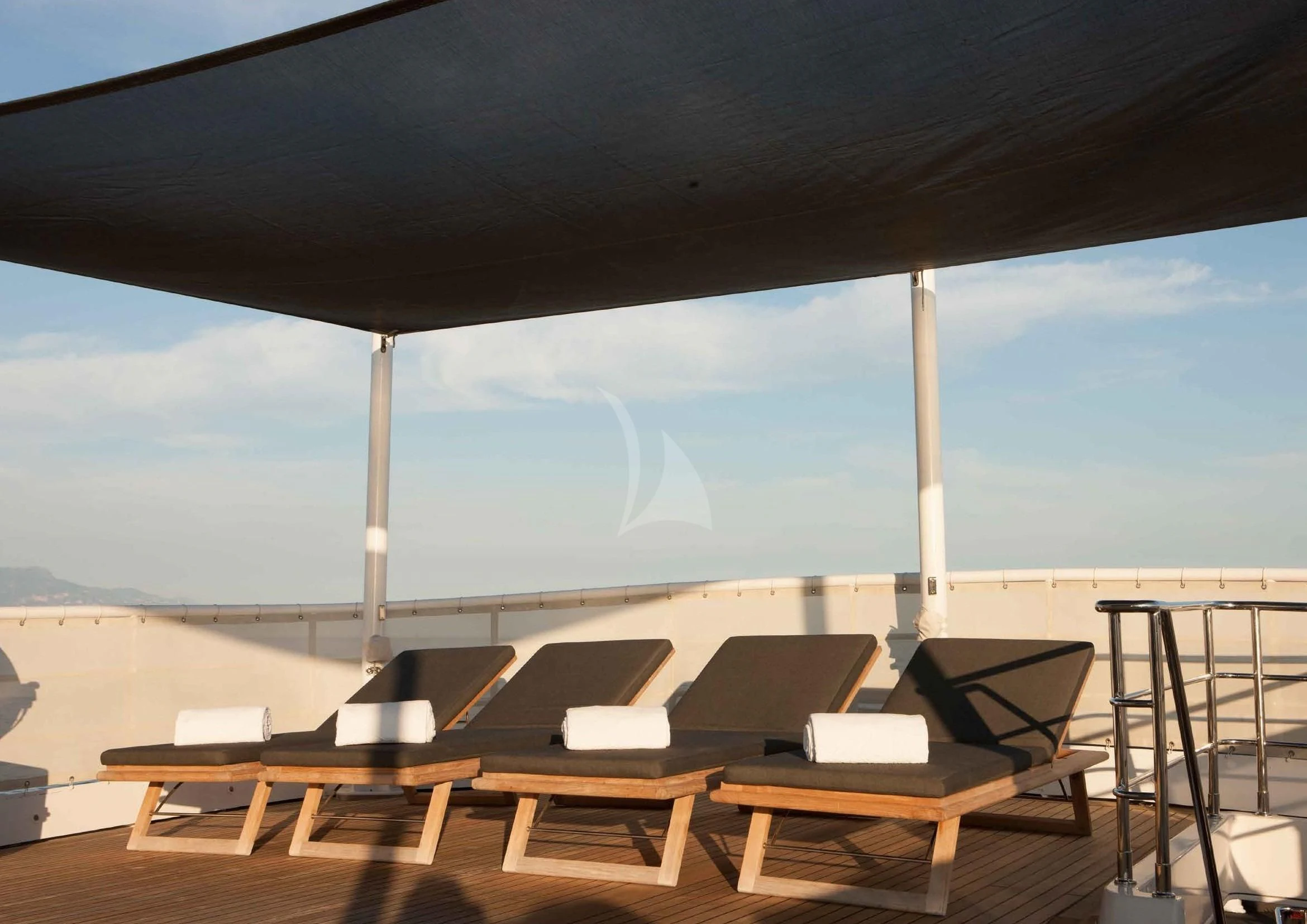 a patio with a table and chairs aboard ICE LADY Yacht for Sale