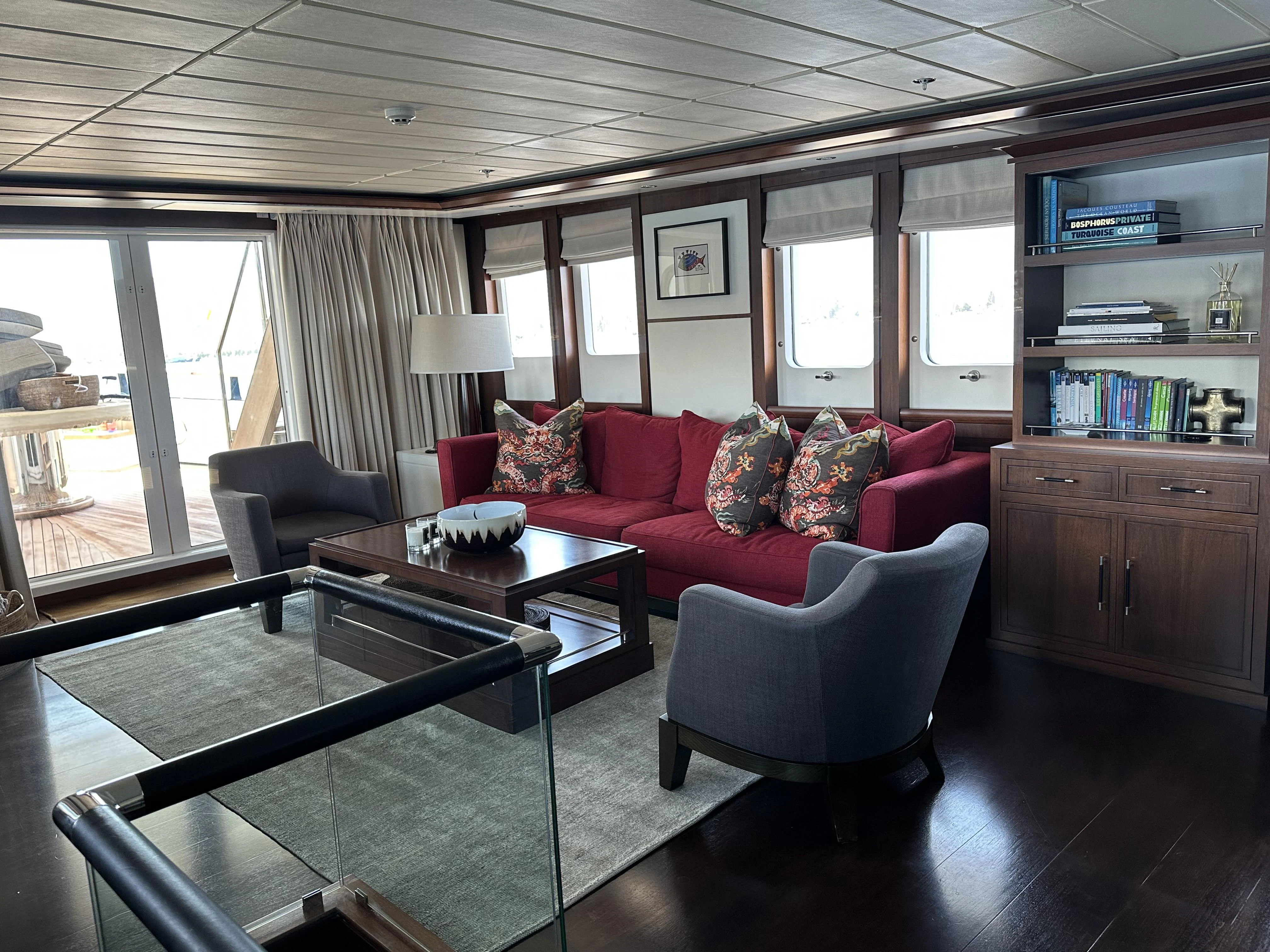 a living room with a couch and a coffee table aboard ICE LADY Yacht for Sale