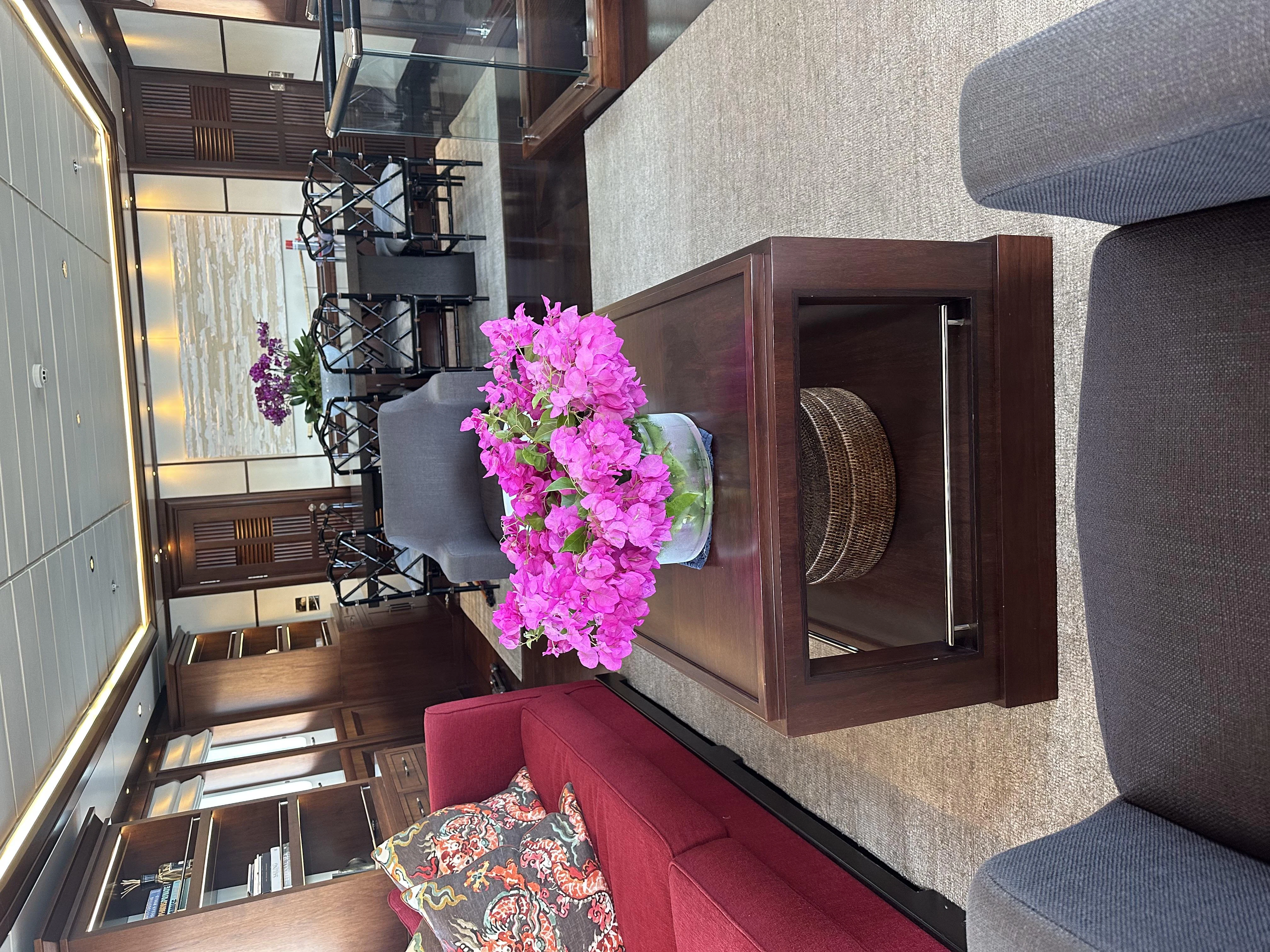 a room with a table and chairs aboard ICE LADY Yacht for Sale