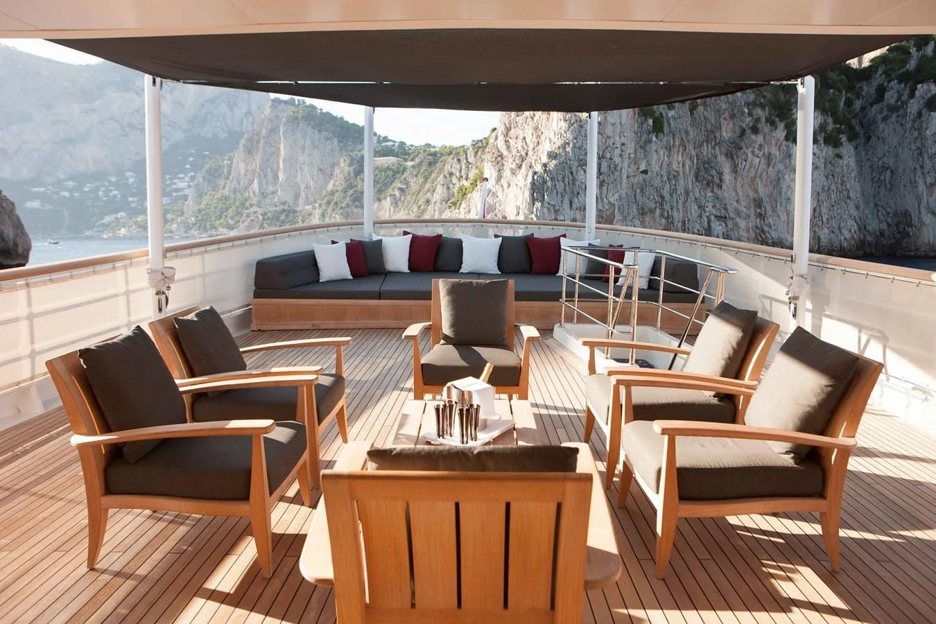 a room with a table chairs and a large window aboard ICE LADY Yacht for Sale