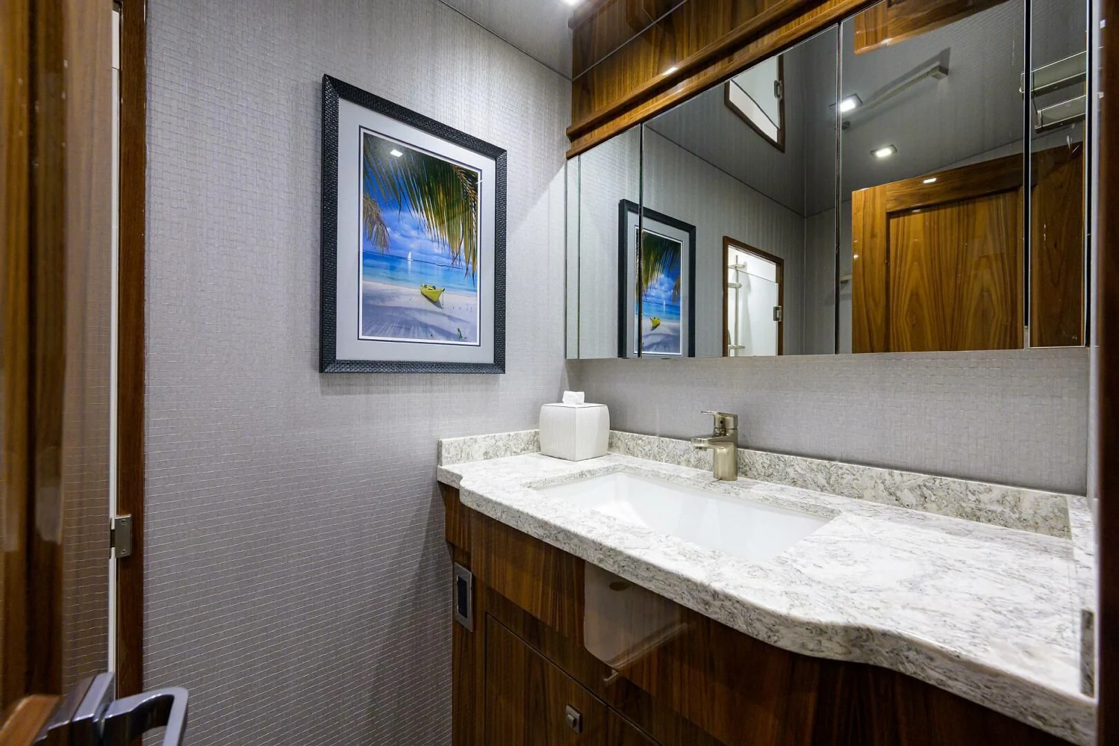 a bathroom with a large mirror aboard SURFBUM Yacht for Sale