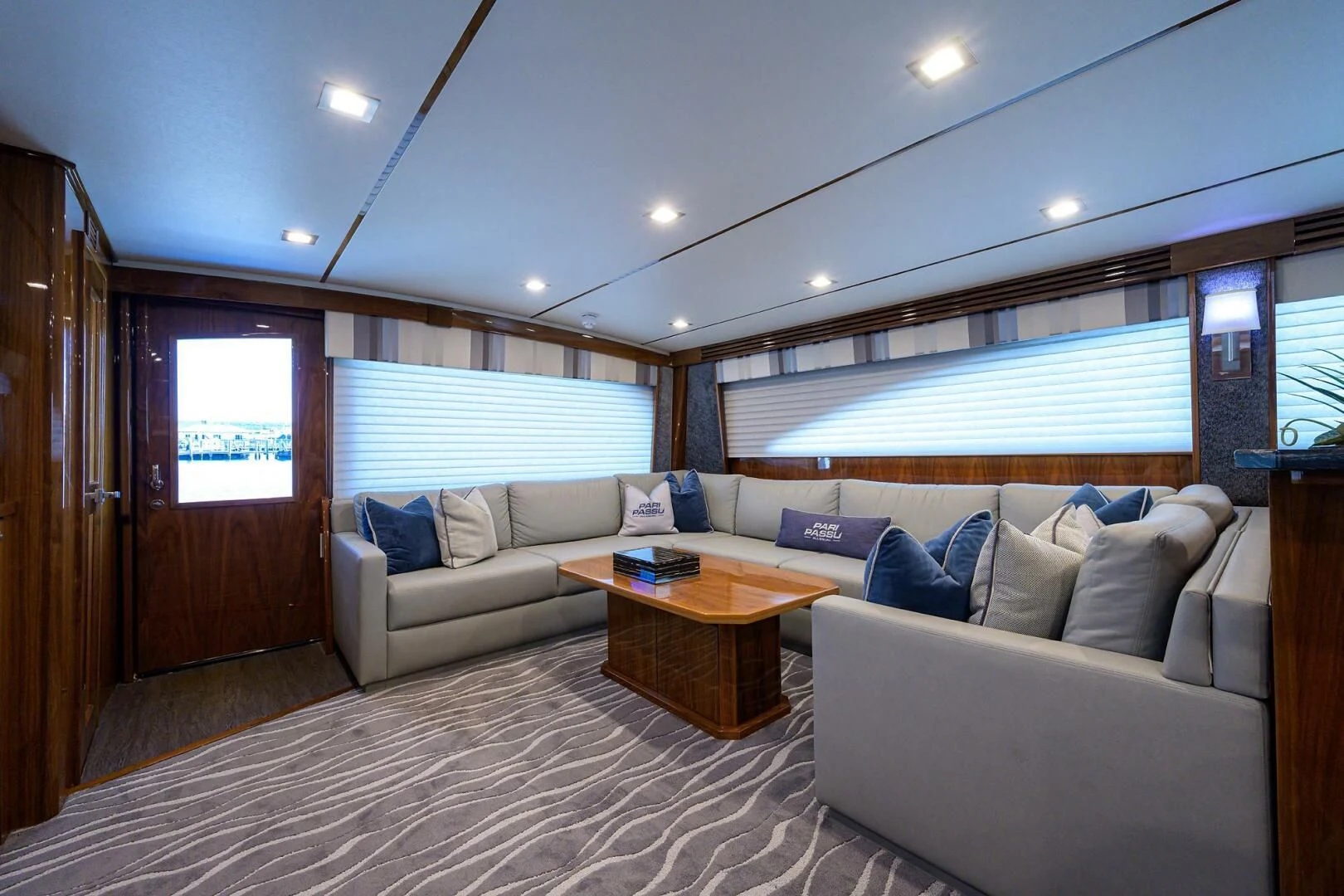 a living room with a couch and a table aboard SURFBUM Yacht for Sale