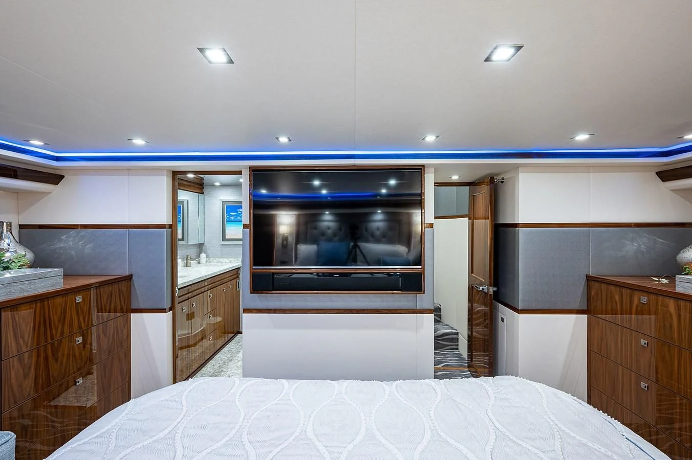 a bedroom with a bed and a television aboard SURFBUM Yacht for Sale