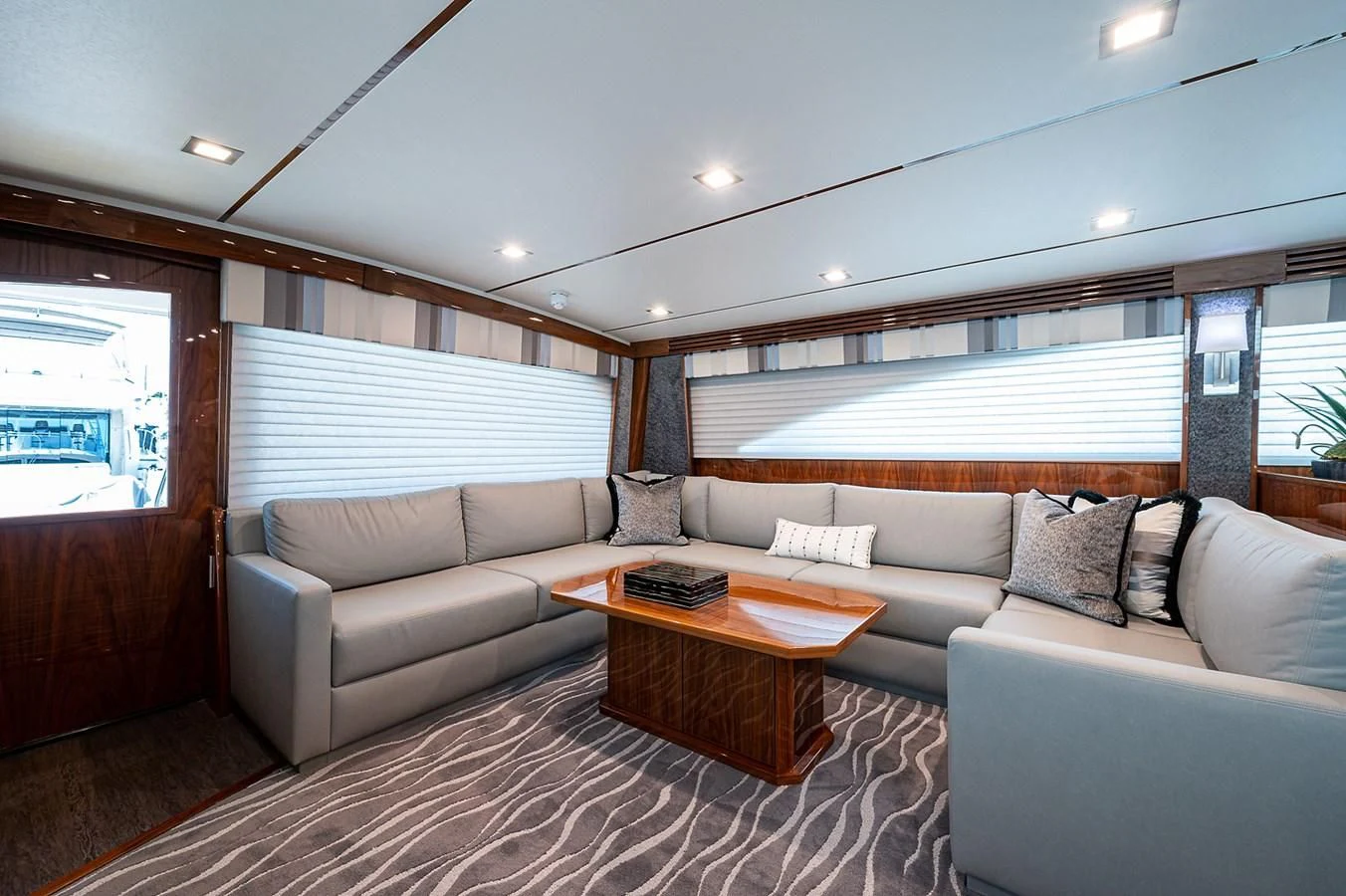 a living room with a couch and a table aboard SURFBUM Yacht for Sale