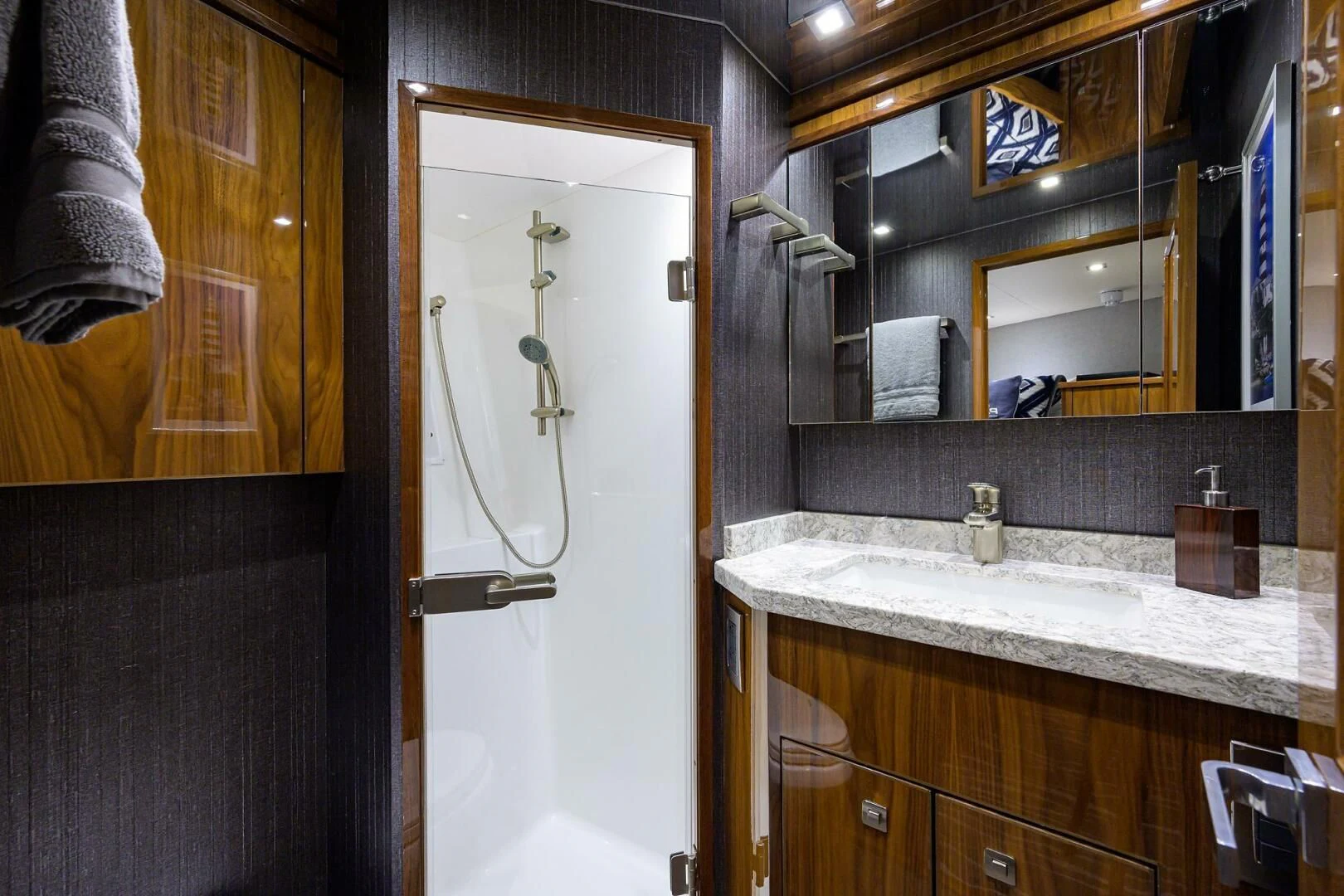a bathroom with a sink and a mirror aboard SURFBUM Yacht for Sale