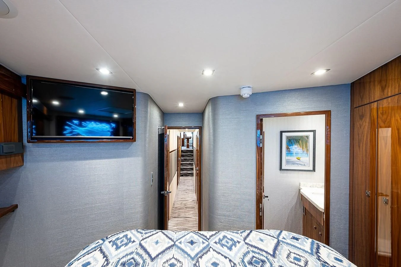 a bedroom with a bed and a closet aboard SURFBUM Yacht for Sale