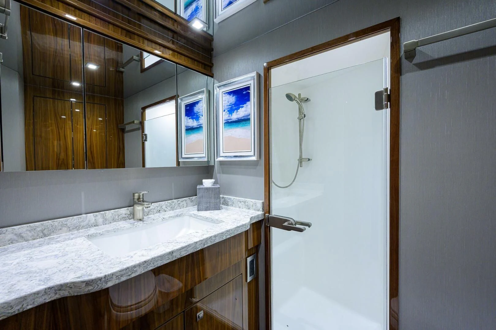 a bathroom with a large mirror aboard SURFBUM Yacht for Sale