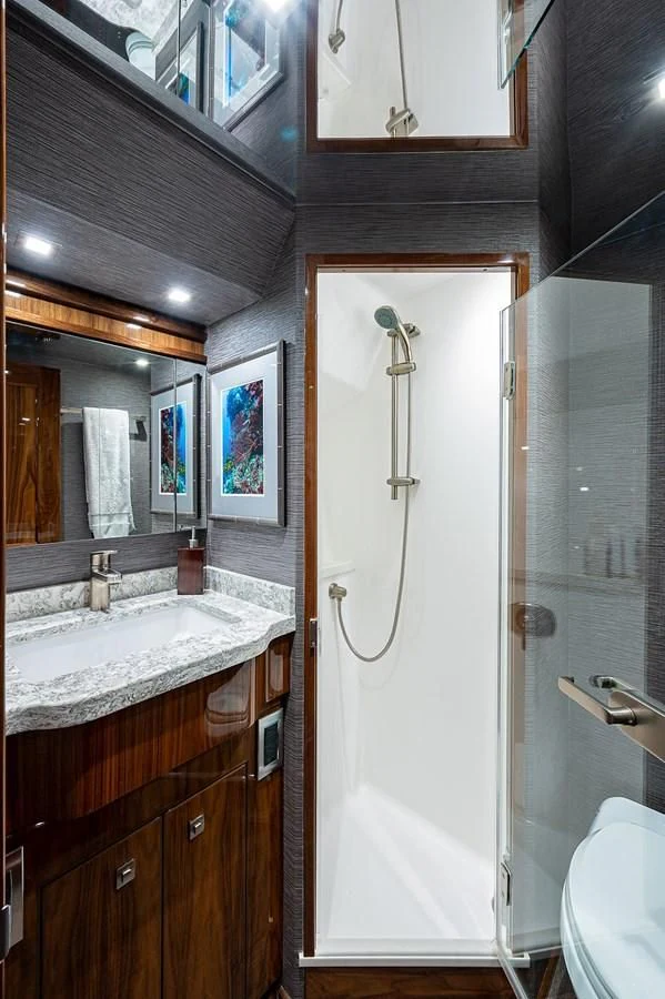 a bathroom with a sink and a toilet aboard SURFBUM Yacht for Sale