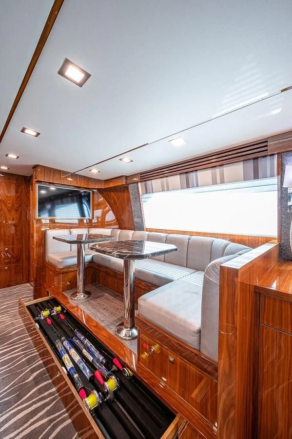 a living room with a couch and a coffee table aboard SURFBUM Yacht for Sale