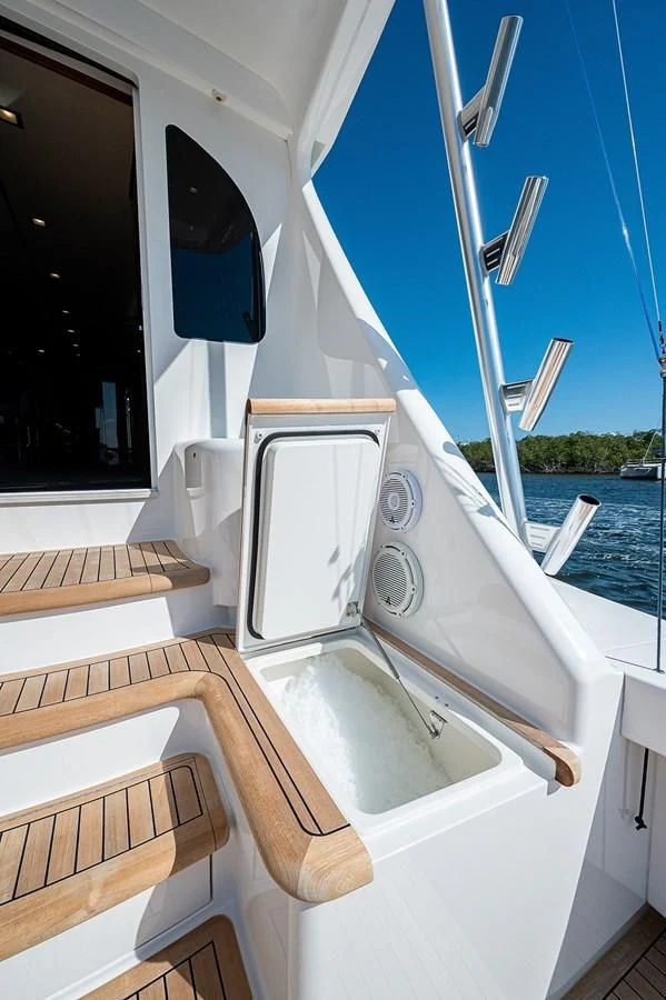 a white bathtub with a wooden seat and a window aboard SURFBUM Yacht for Sale