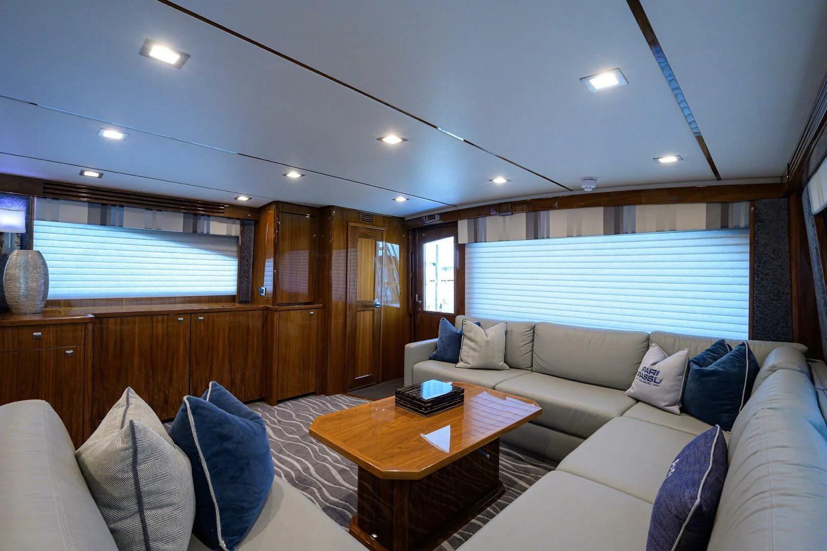 a living room with a couch and a coffee table aboard SURFBUM Yacht for Sale