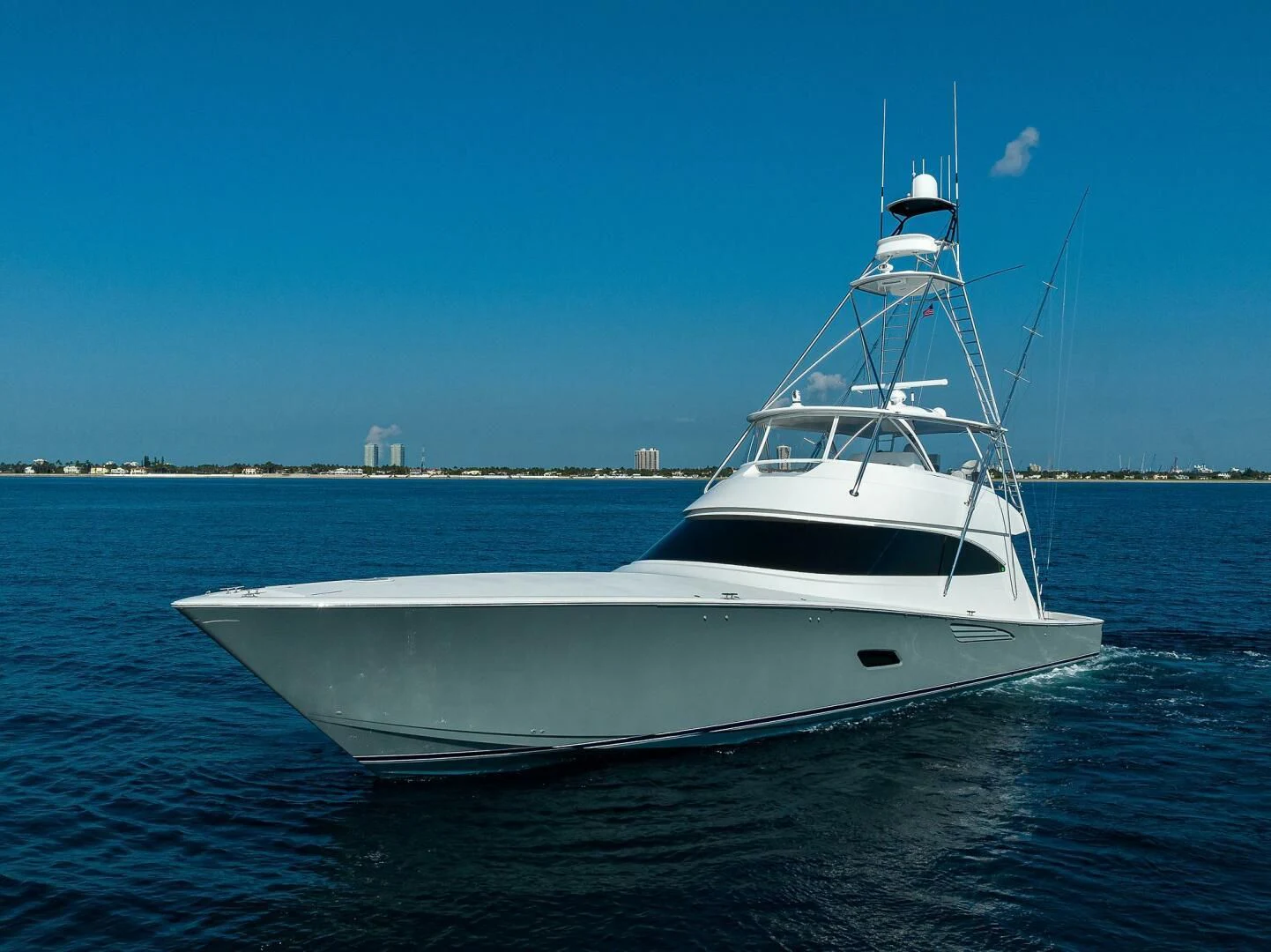 a white yacht in the water aboard SURFBUM Yacht for Sale