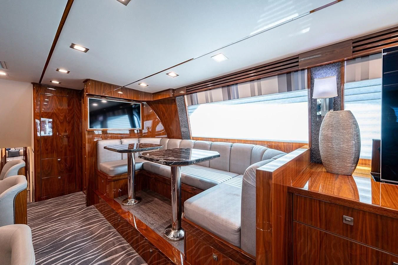 a living room with a large window aboard SURFBUM Yacht for Sale