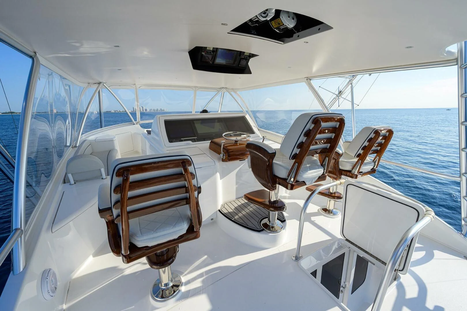 a boat with a couple of seats on the deck aboard SURFBUM Yacht for Sale