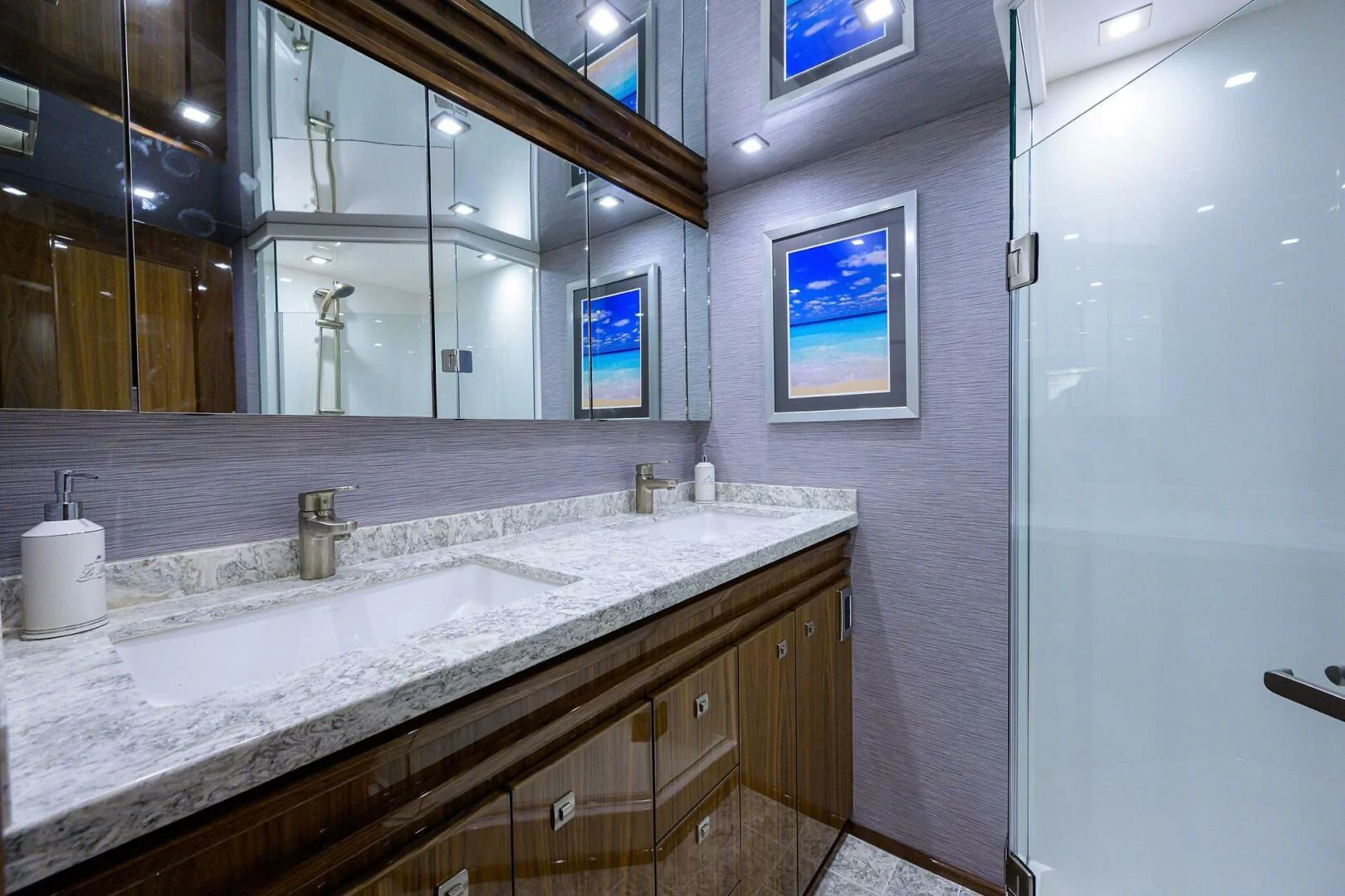 a bathroom with a large mirror aboard SURFBUM Yacht for Sale