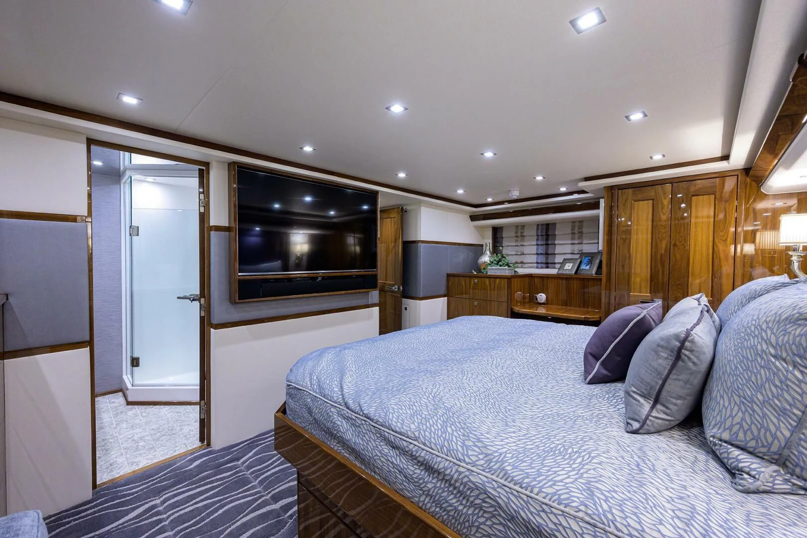 a large bedroom with a large bed aboard SURFBUM Yacht for Sale