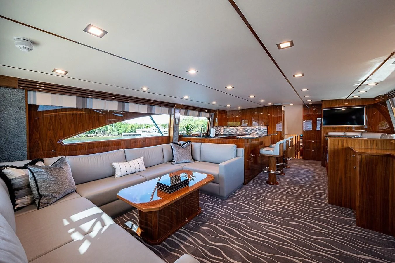 a living room with a couch and a coffee table aboard SURFBUM Yacht for Sale