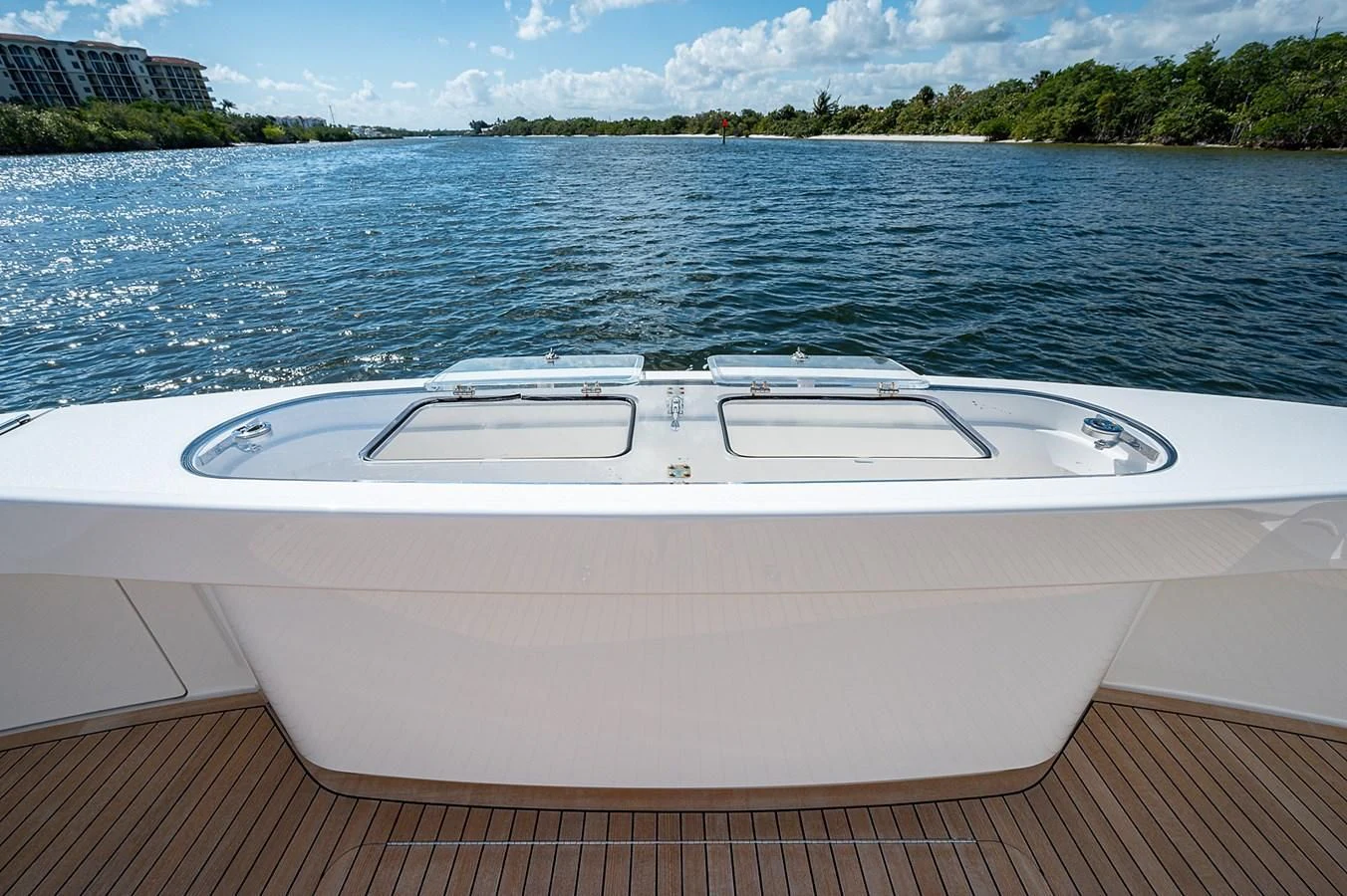 a white boat on a dock aboard SURFBUM Yacht for Sale