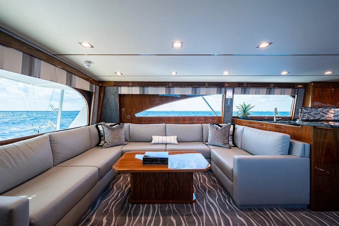 a living room with a large window aboard SURFBUM Yacht for Sale