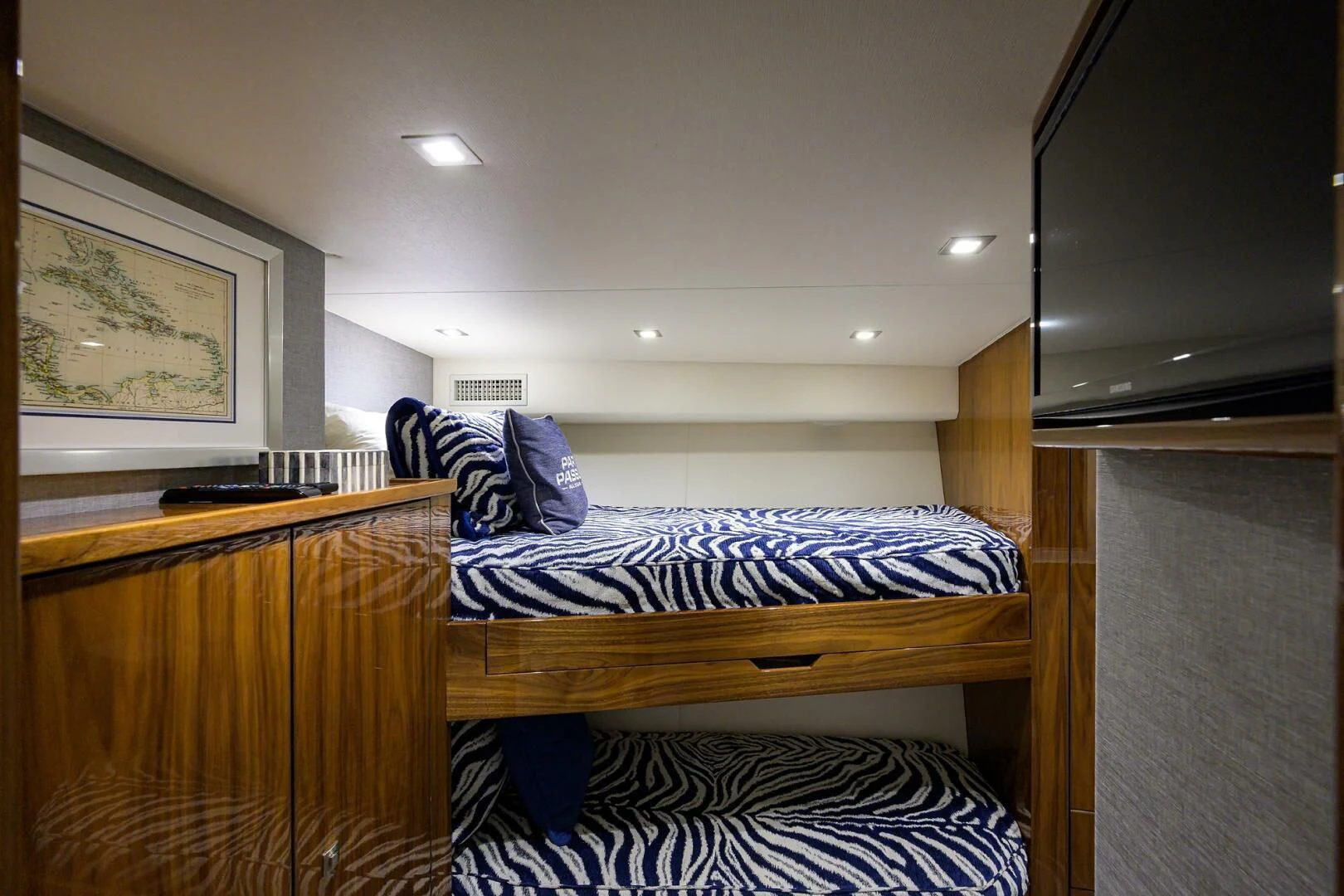 a bedroom with a bed and a desk aboard SURFBUM Yacht for Sale