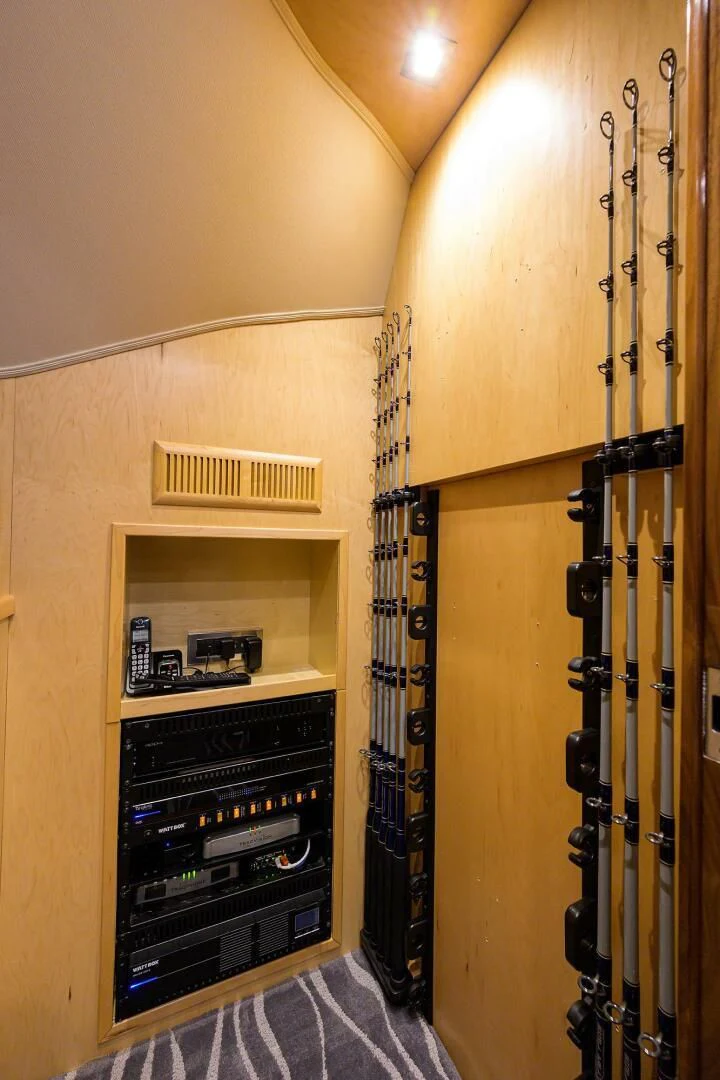 a closet with a vent and a shelf with wires aboard SURFBUM Yacht for Sale