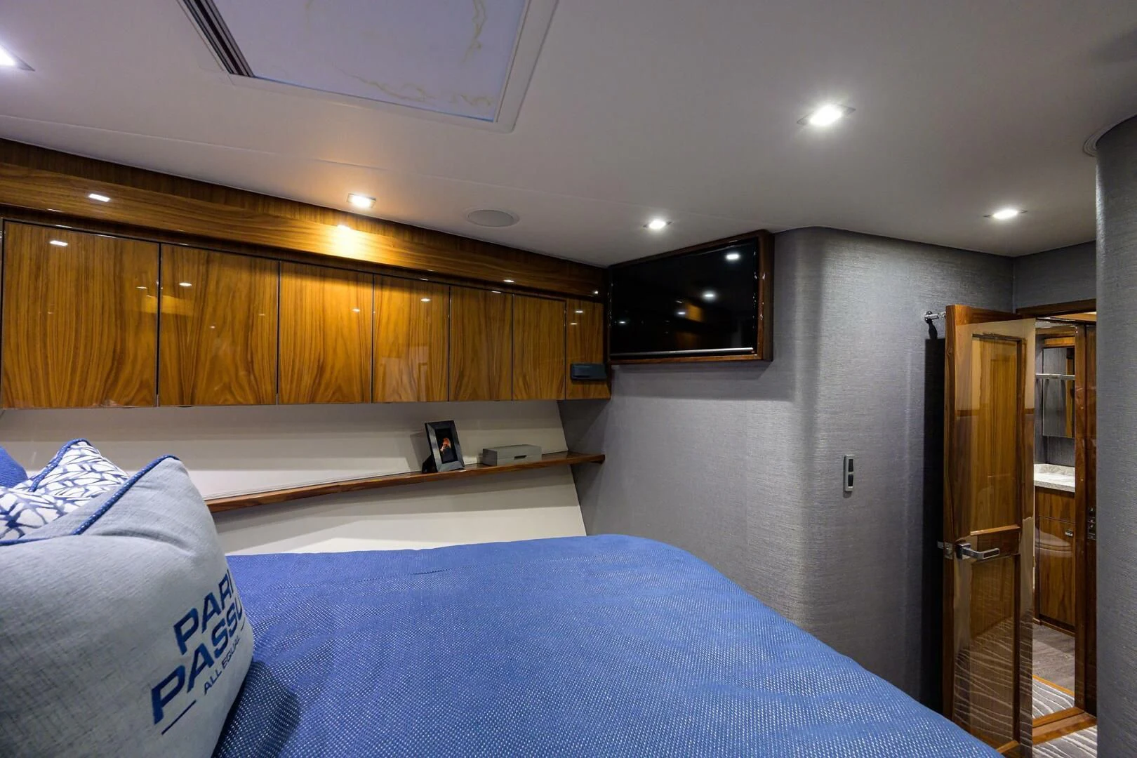 a bedroom with a bed and a closet aboard SURFBUM Yacht for Sale