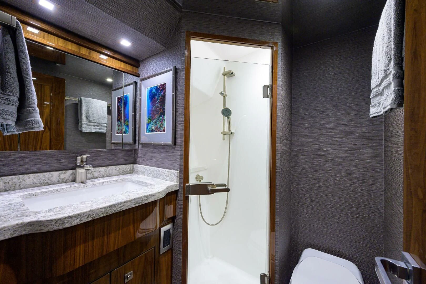 a bathroom with a sink and a mirror aboard SURFBUM Yacht for Sale