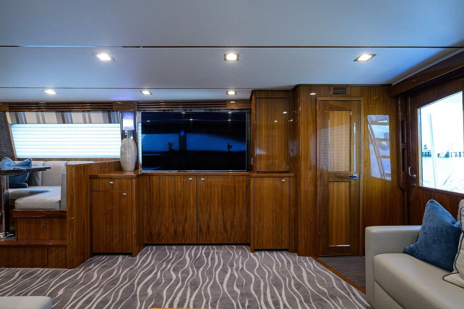 a room with a bed and a television aboard SURFBUM Yacht for Sale