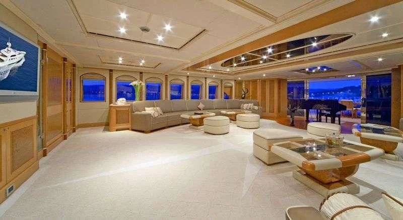 a large room with a large white floor and a large window aboard SENSATION Yacht for Sale