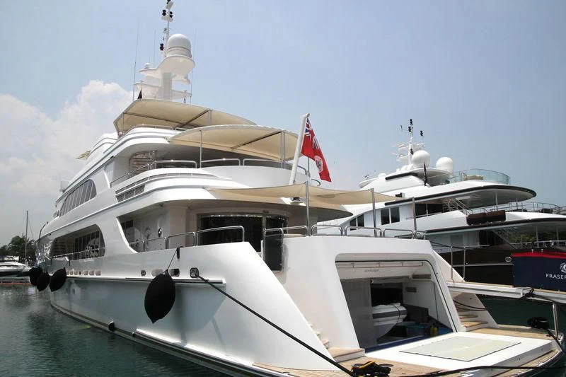 a boat with a flag on it aboard SENSATION Yacht for Sale