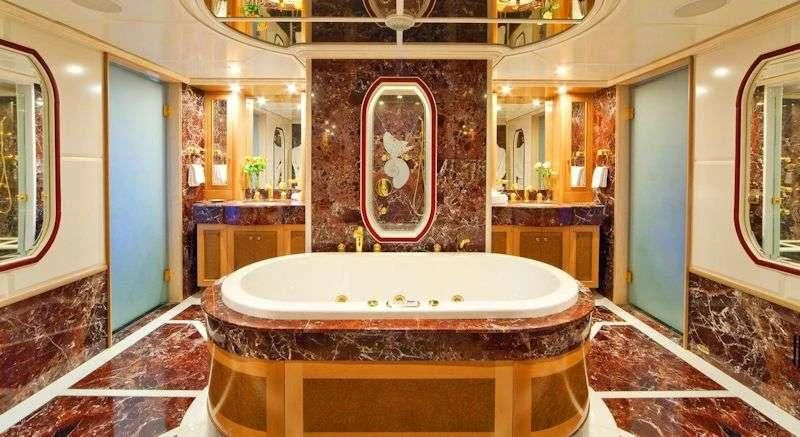 a large bathroom with a large jacuzzi tub aboard SENSATION Yacht for Sale