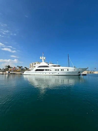 a large white boat in the water aboard SENSATION Yacht for Sale