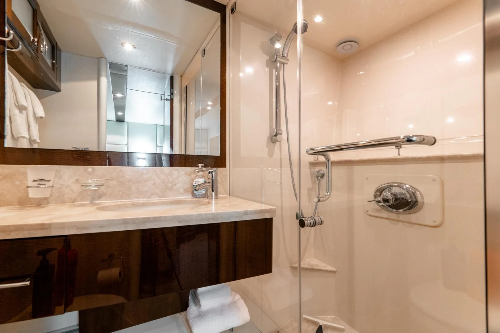 a bathroom with a shower and sink aboard SALACIA Yacht for Sale
