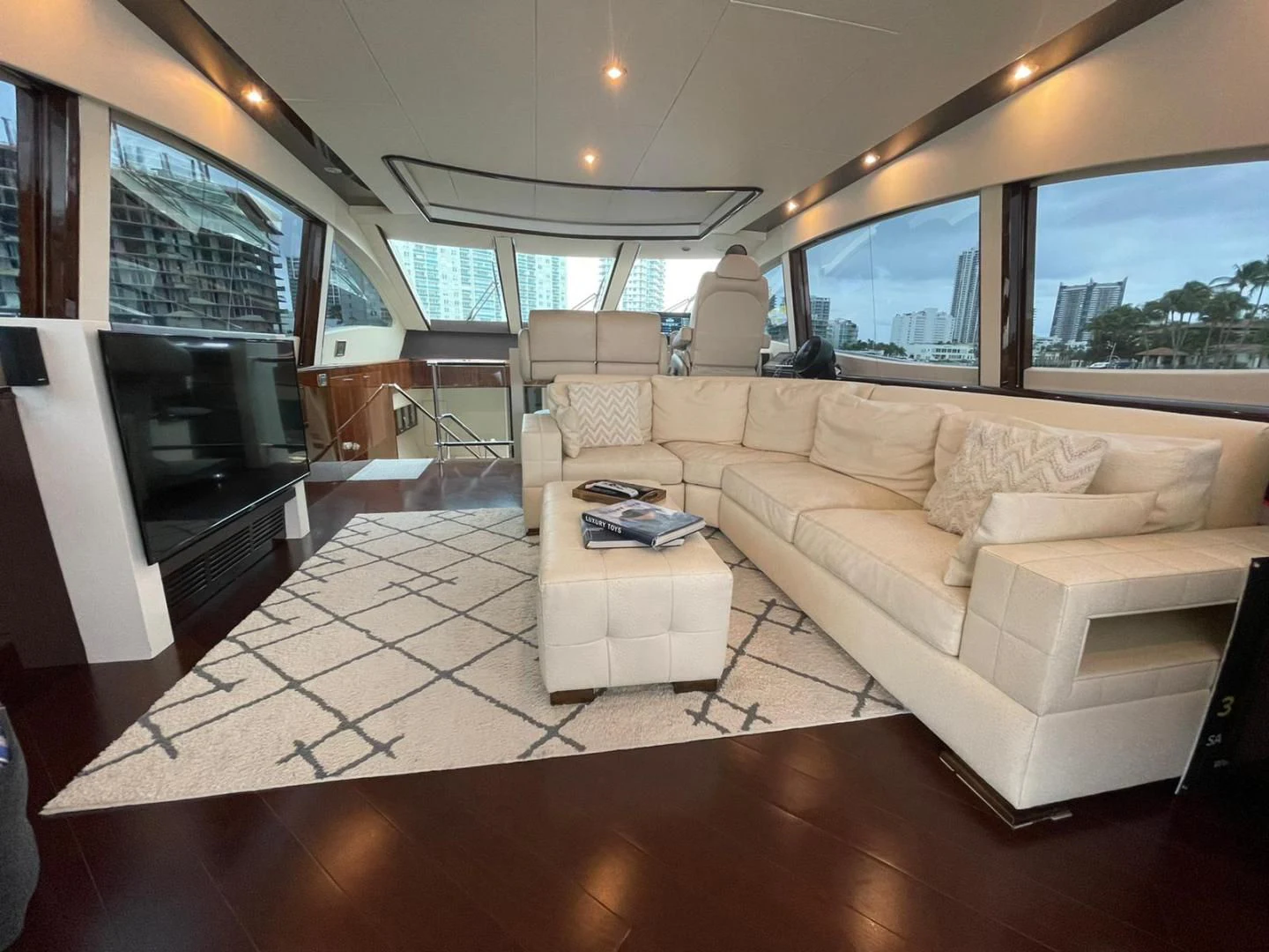 a living room with a large window aboard SALACIA Yacht for Sale
