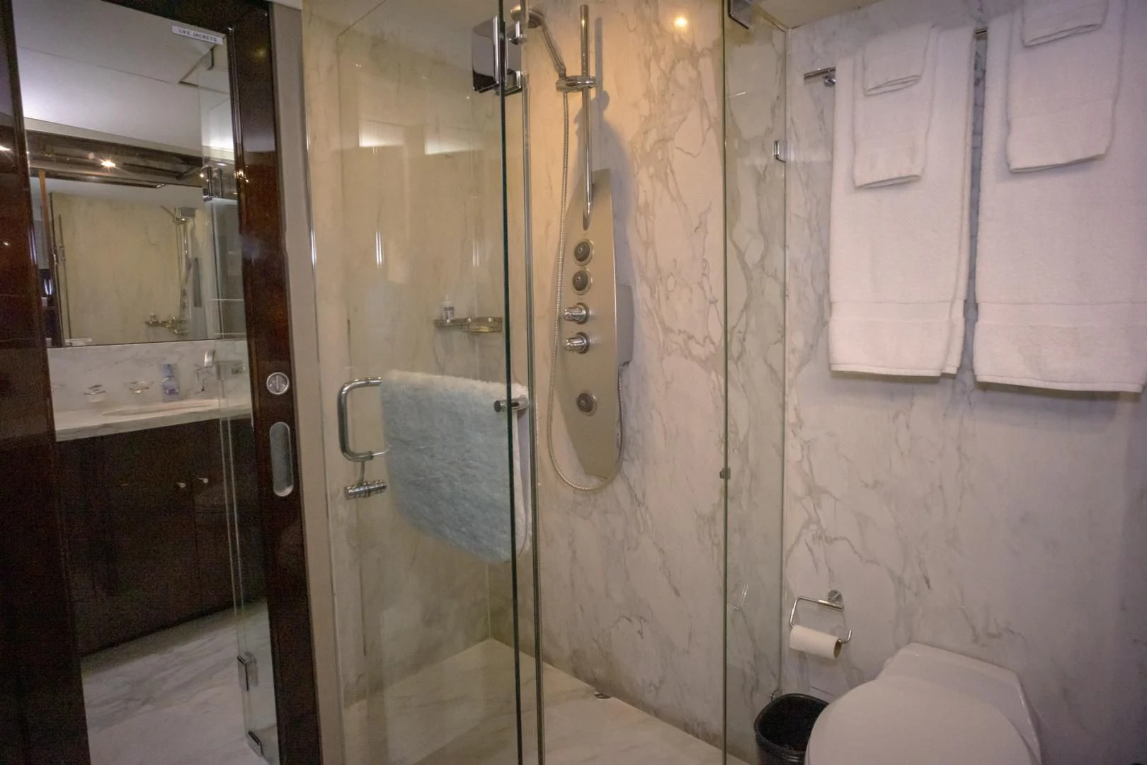 a bathroom with a shower and toilet aboard SALACIA Yacht for Sale