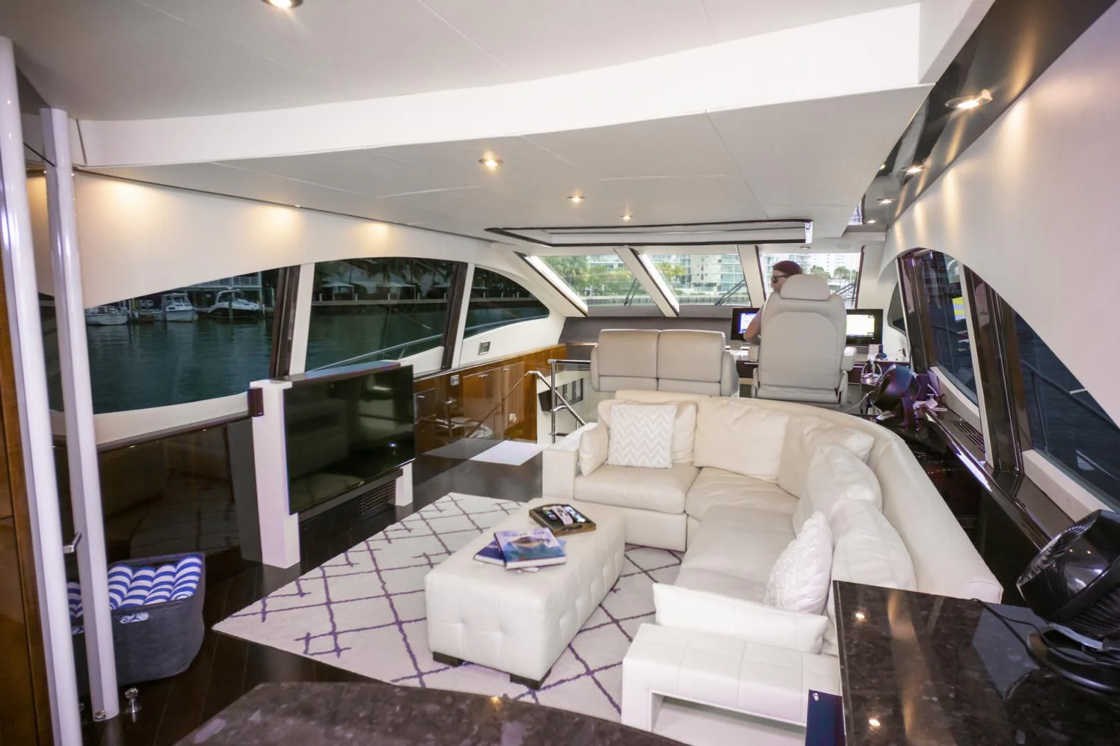 a room with a couch and a television aboard SALACIA Yacht for Sale