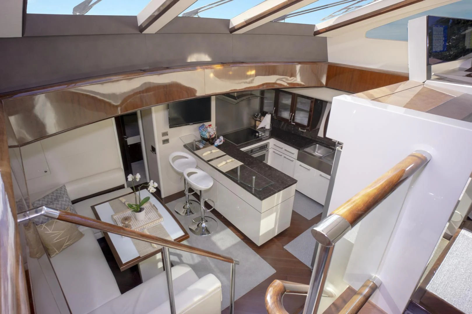 a kitchen with a table and chairs aboard SALACIA Yacht for Sale