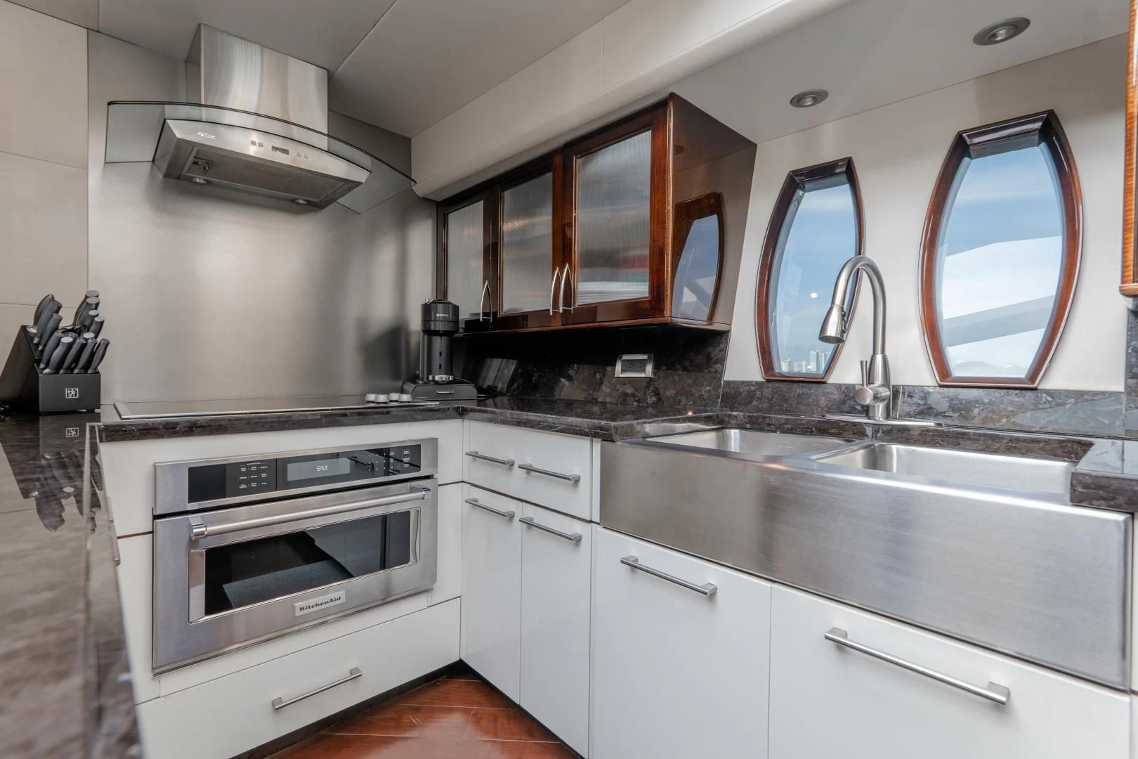 a kitchen with white cabinets aboard SALACIA Yacht for Sale