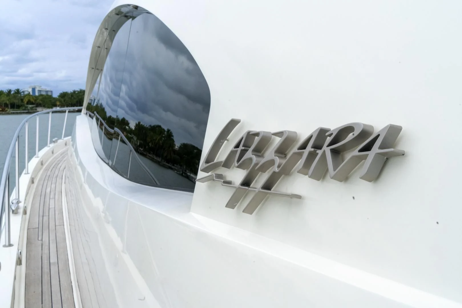 a white car with a broken wing aboard SALACIA Yacht for Sale