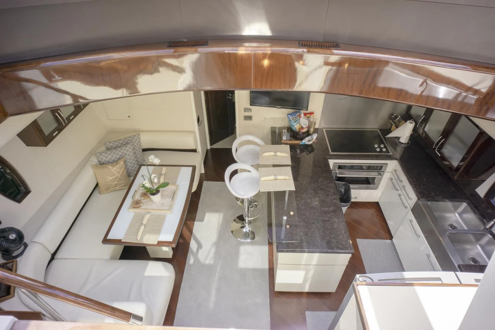 a kitchen with white cabinets aboard SALACIA Yacht for Sale