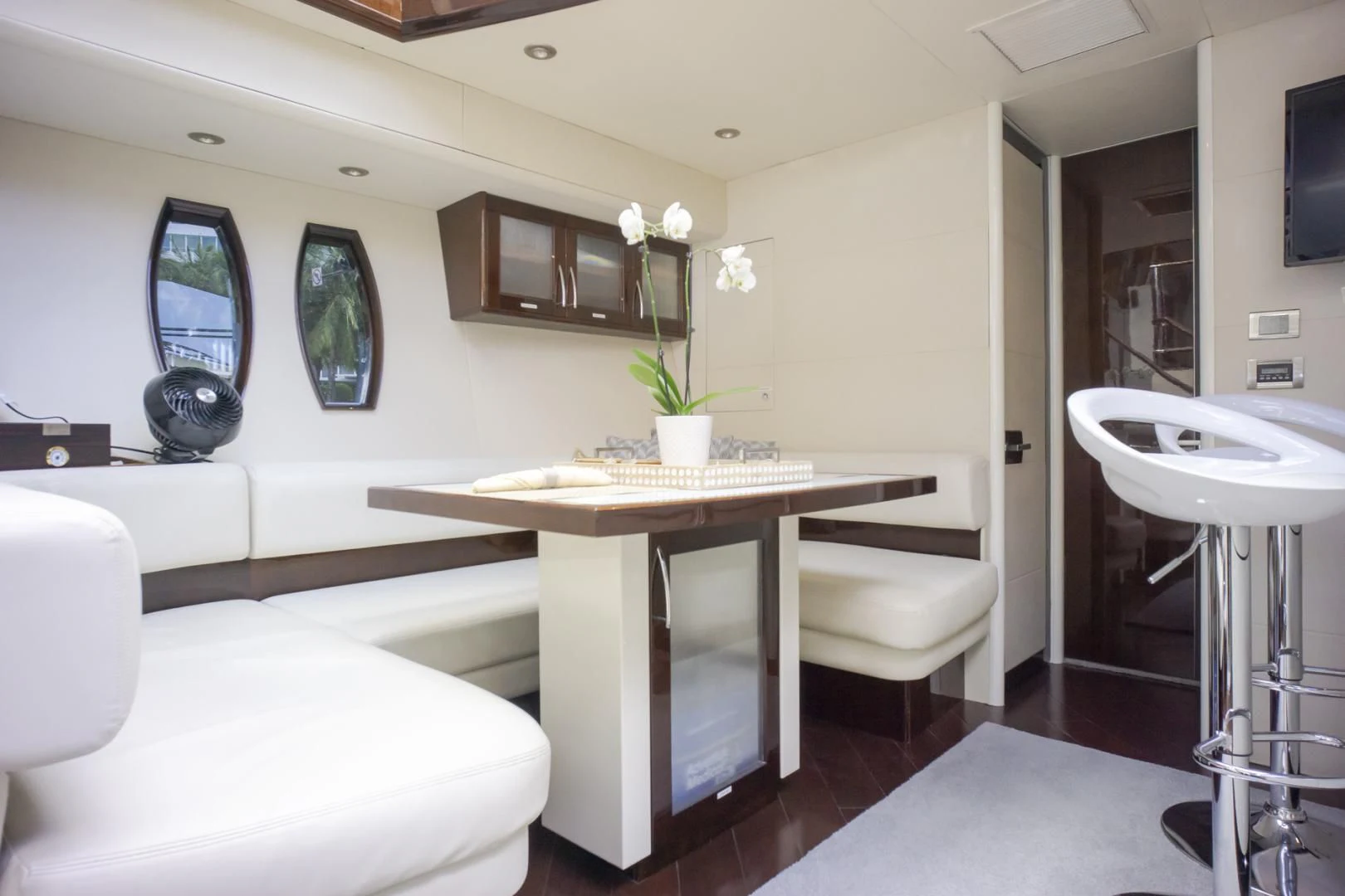 a room with a table and chairs aboard SALACIA Yacht for Sale