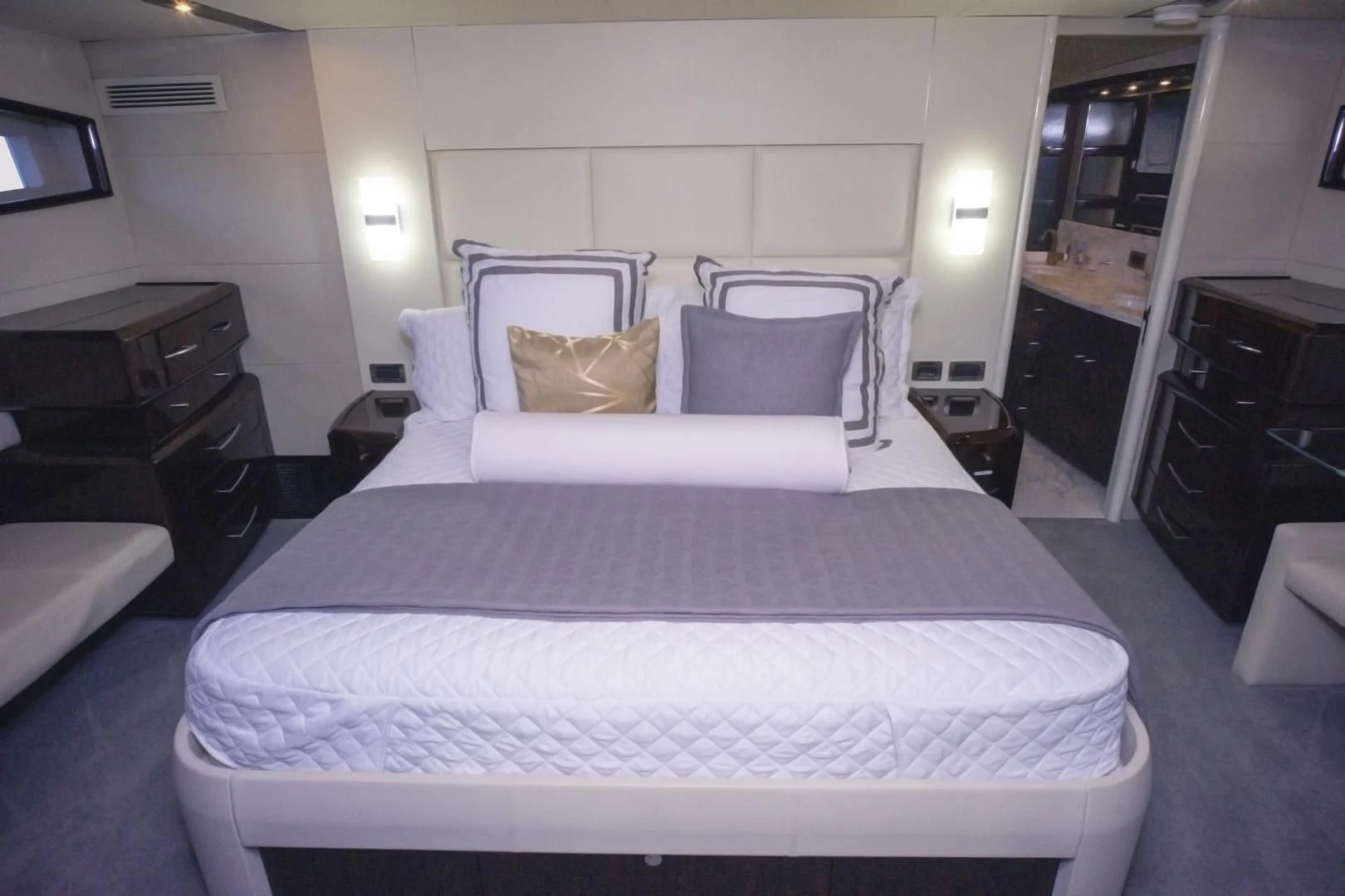 a bed with white sheets aboard SALACIA Yacht for Sale