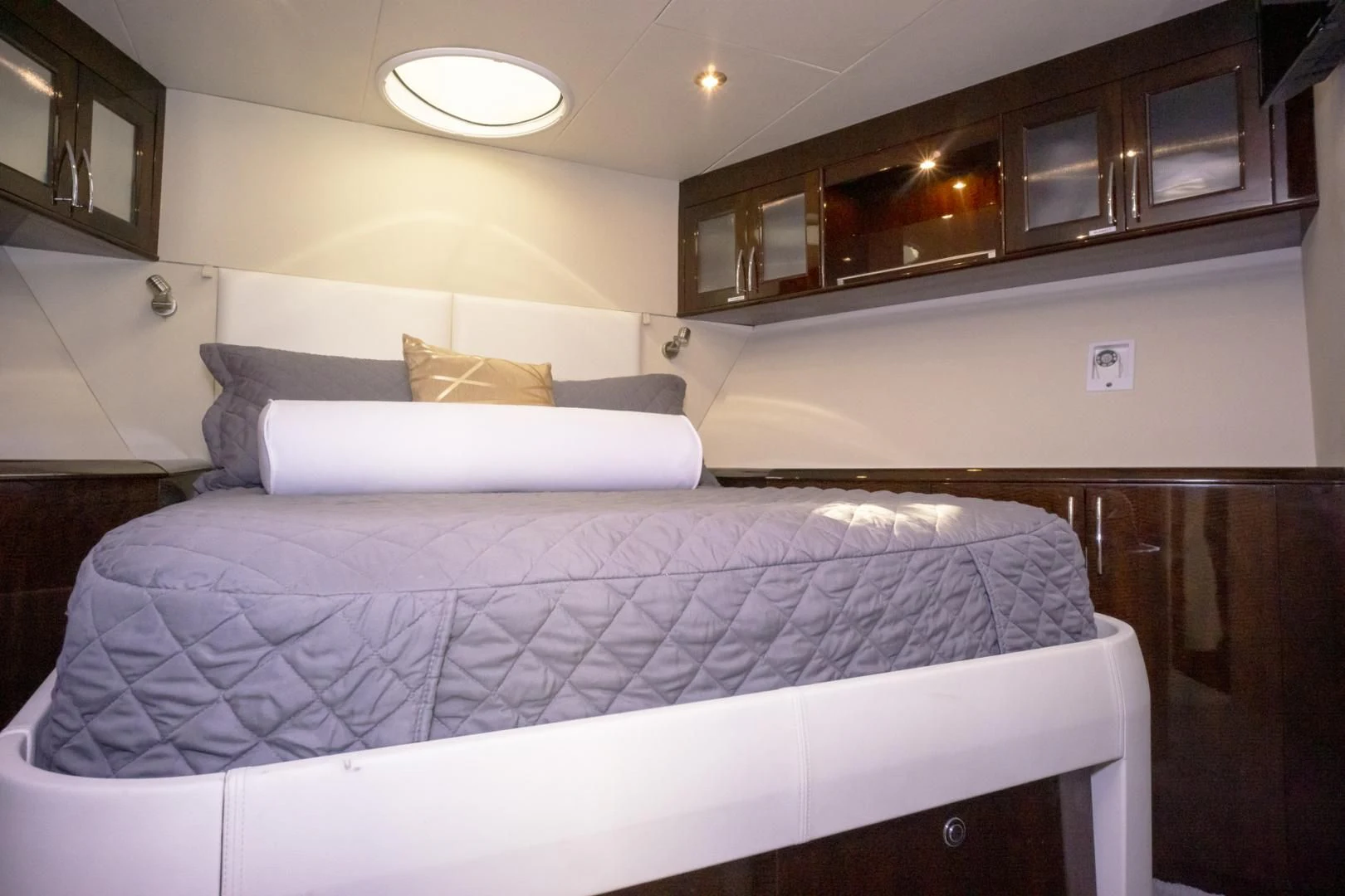 a bed with a white comforter aboard SALACIA Yacht for Sale