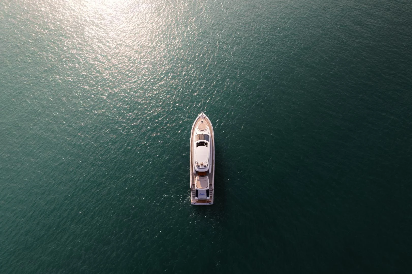 a white car on a body of water aboard SALACIA Yacht for Sale