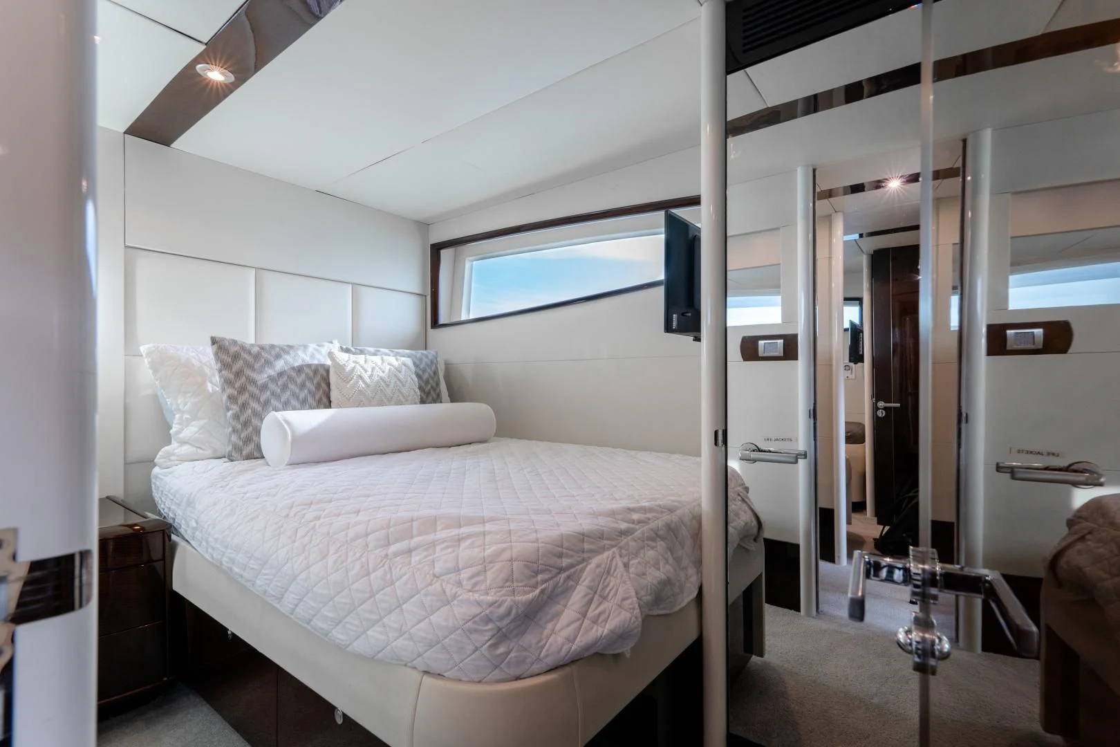a bed in a room aboard SALACIA Yacht for Sale