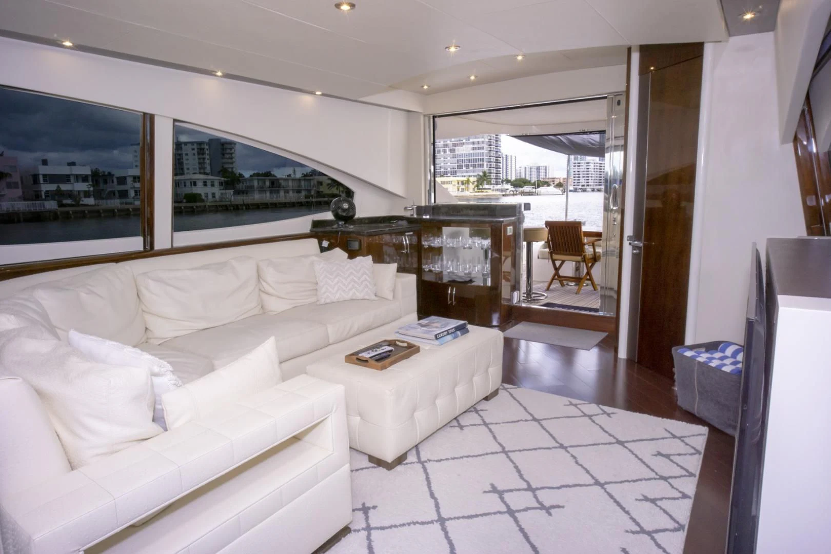 a living room with a large window aboard SALACIA Yacht for Sale