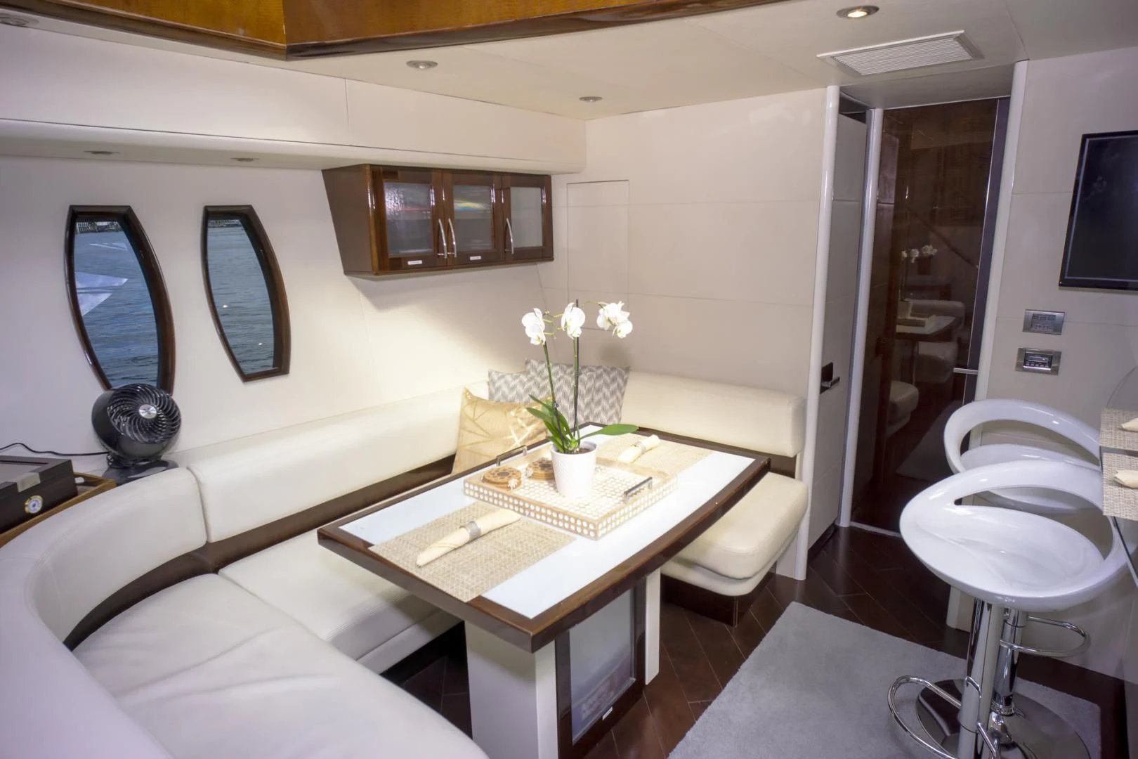 a room with a table and chairs aboard SALACIA Yacht for Sale